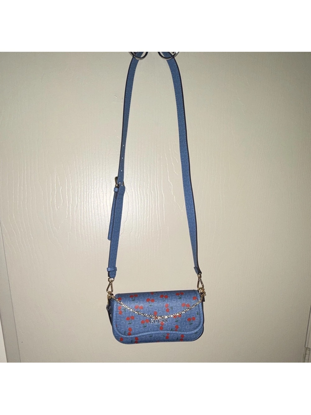 Guess Blue Crossbody with Red Floral Print and Gold Chain Accent